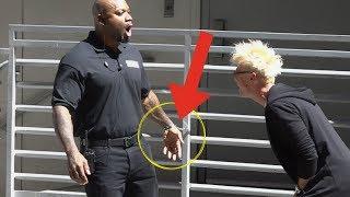 HANDCUFFING A SECURITY GUARD TO A FENCE - MAGIC PRANK!!!