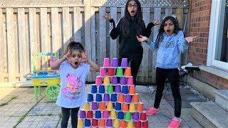 Kids pretend play Builds COLORFUL cup wall - funny kids video